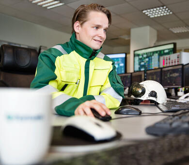 young man by computer at Fortum